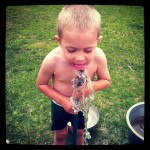 Drinking from the hose, in true boy style.